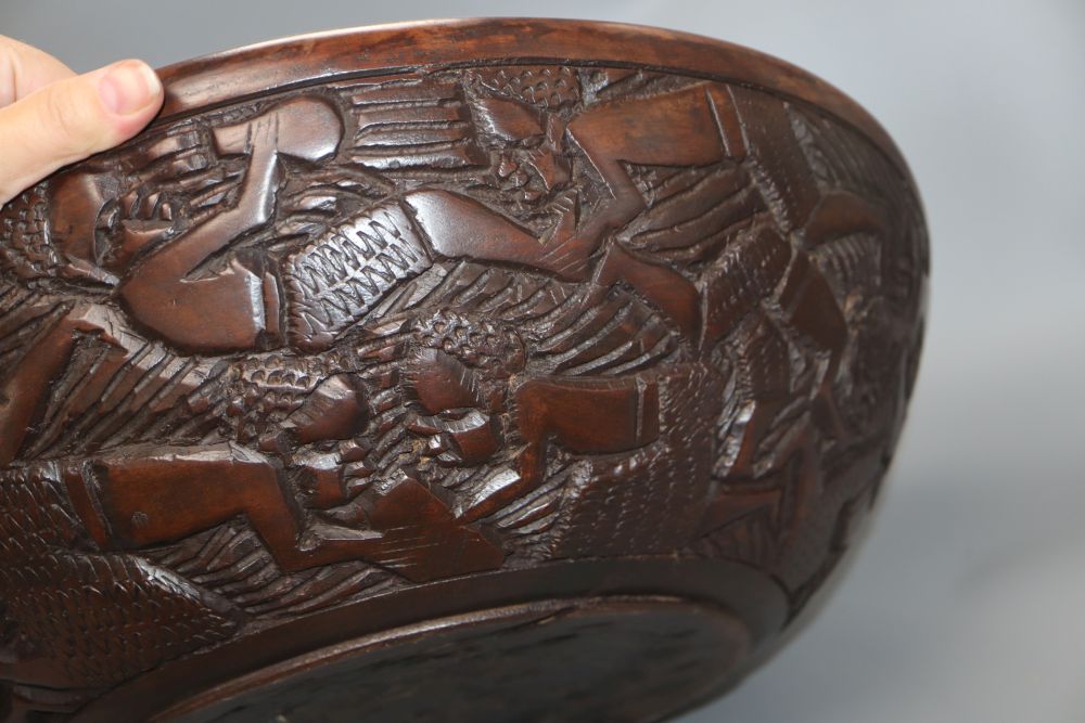 An African carved wood bowl, diameter 43cm